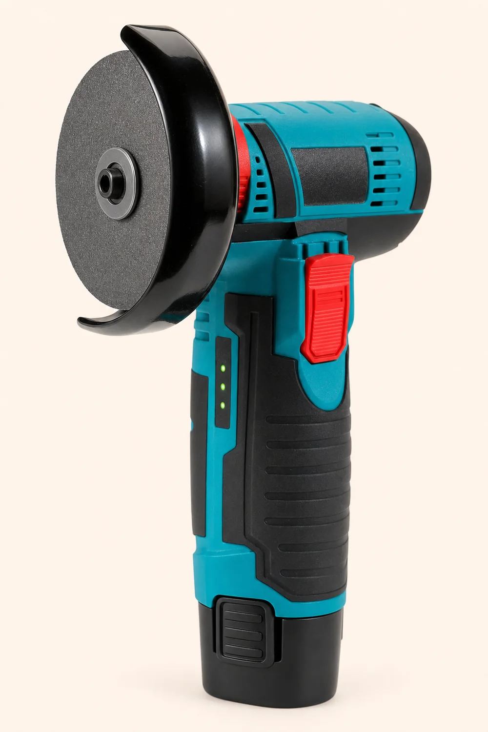 Mini szlifierka Iskrzyk — tealowy korpus, czerwony przełącznik, tarcza 76 mm i akumulator 12 V wsuwany od dołu rękojeści.